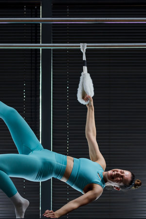 Engaging workout session on reformer pilates machines in a modern fitness studio featuring a...