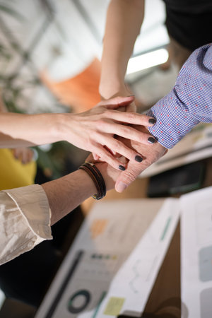 Business teamwork collaboration among diverse professionals during a meeting in a modern office space focused on project planning and strategy developmentの写真素材