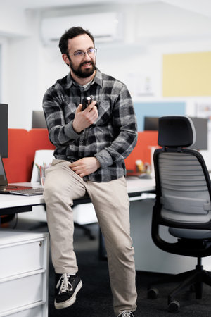 Business professional discussing ideas in a modern office setting during the dayの写真素材