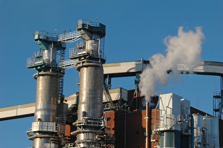 Factory with smoke on skyの写真素材