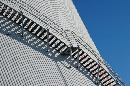 steps of Factory towers roof on sky backgroundの写真素材