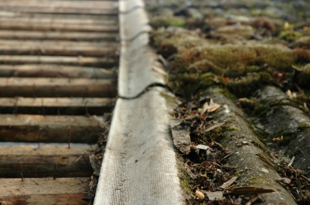 old demaged roof with moss 