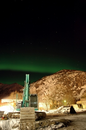 Aurora borealis  northern lights  and lots of stars around the constellation  Big Dipper  and excavator の写真素材