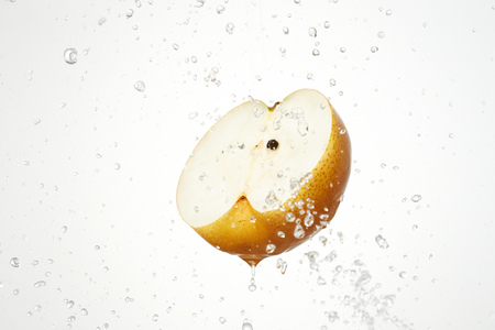 the pear with water splashの写真素材