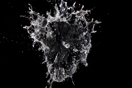 Water splash isolated on black backgroundの写真素材