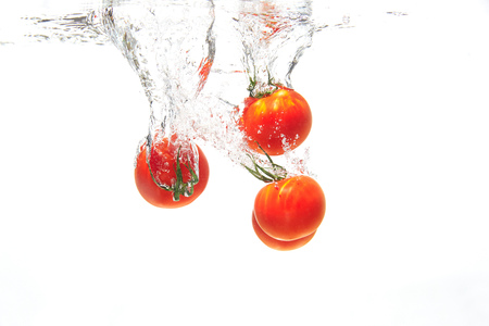 cherry tomato under the waterの写真素材
