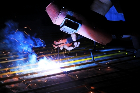 Industrial worker make a spark welding 