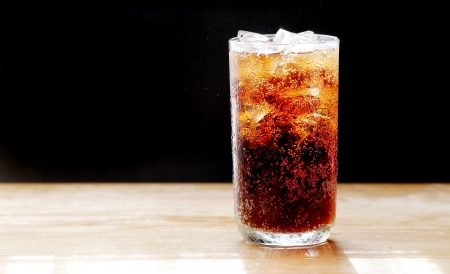 cola and ice,bubble in glass, black background.の写真素材