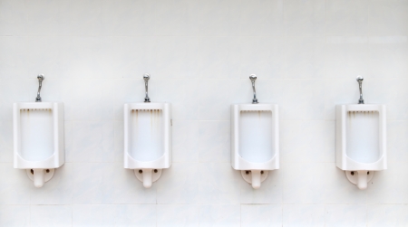 Row of old  four urinalsの写真素材
