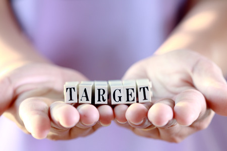 Business success concept, Target word on woman hand. 