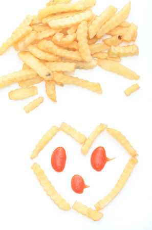 Close up French fries potatoes isolated on white background.の写真素材