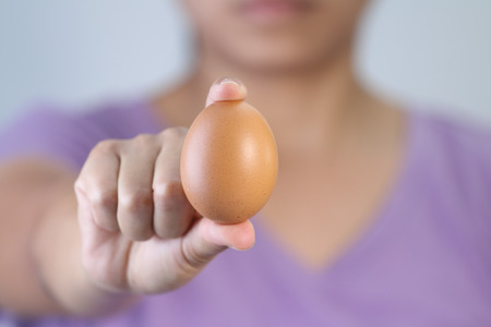 Woman hands with eggの写真素材