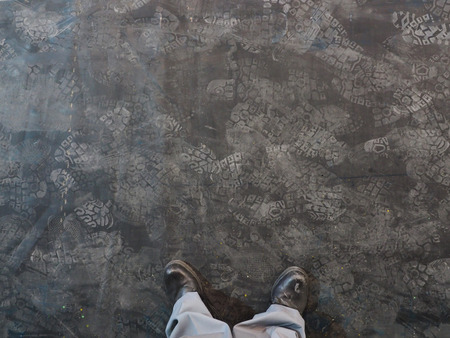 Shoes print on dark background.の写真素材