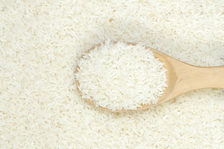 Spoon of jasmine rice background.の写真素材