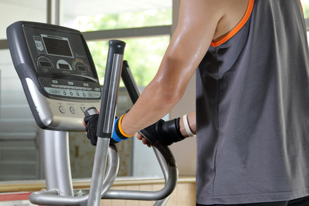 Exercising in the gym,Man walking on treadmill.