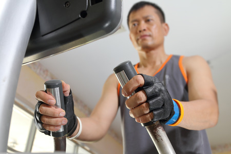 Exercising in the gym,Man walking on treadmill.
