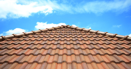 Brown brick roof , blue sky background.の写真素材