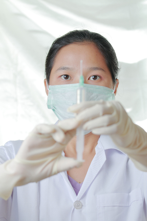 nurse holding syringe,Select focus.の写真素材