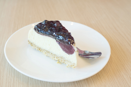 Blackberries cheesecake on a plate.の写真素材