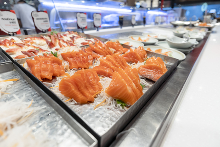 Fish slides placed in trays, Japanese restaurantsの写真素材