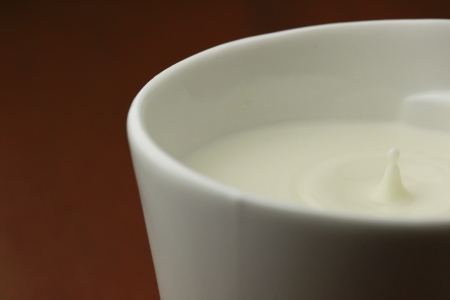 Milk drops in the cupの写真素材