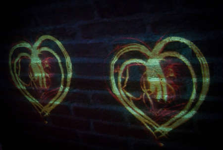Hearts projected on brick wallの写真素材