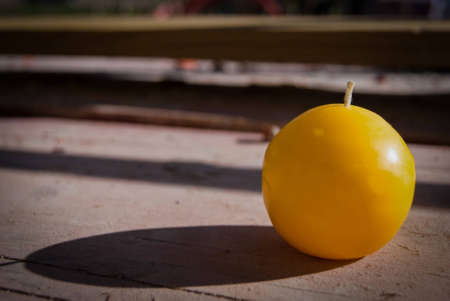 candle put outside on wood boardの写真素材