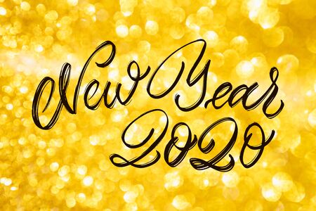 Happy New Year Calligraphy text with colorful hand drawn snowflakes Over Glitter background...