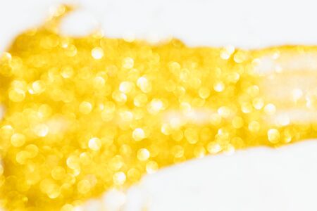 Golden glitter lights background.Christmas background. Golden Holiday abstract Glitter background .Decorative Christmas and New Year party background. Festive backdrop for your projects.の写真素材