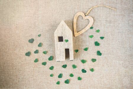 Eco friendly house concept with green leaves on eco background, copy space .Flat lay, top view.の写真素材
