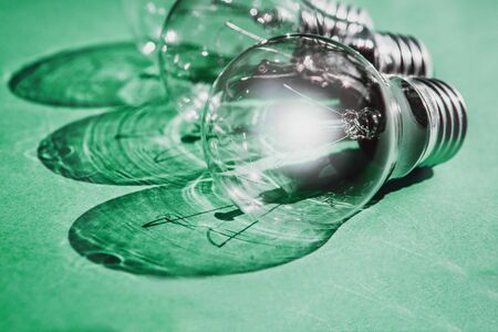 Light bulb on a neo-mint background.I dea concept with light bulbs and glowing bulb on neo-mint background.の写真素材
