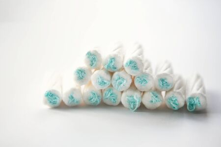 Medical female tampon on a white background. Hygienic white tampon for women....