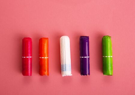 Medical female tampon on a pink background. Hygienic white tampon for women. Menstruation,protection. Tamponsの写真素材