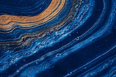 Beautiful textured blue background. Color of the year 2020. Main trend concept. Made with fluid art...
