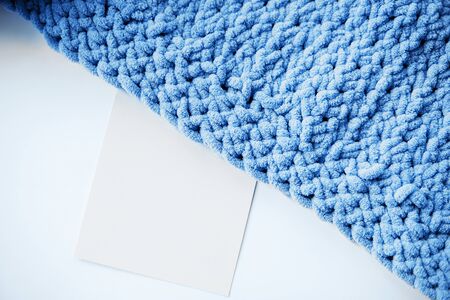 Texture of blue knit blanket. Plaid merino wool. Top view,copy space.
