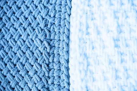 Texture of blue knit blanket. Plaid merino wool. Top view,copy space.