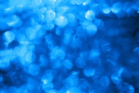 Blue background with blinking stars. Holiday abstract texture.の写真素材