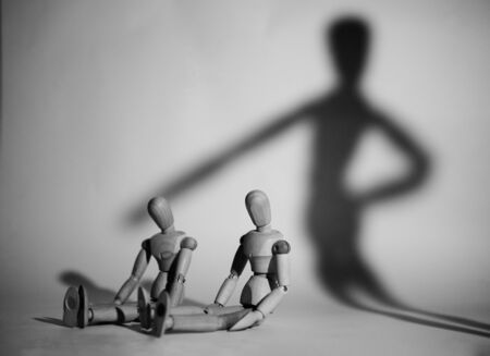 Manipulative Person.Eerie puppeteer hands controlling you on white background.