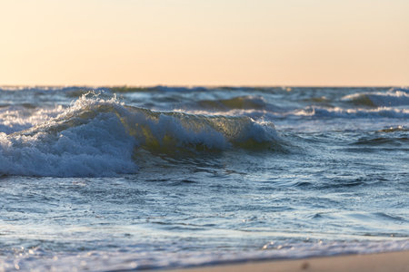 Beautiful sunset on the Baltic sea. Sea waves close-up.