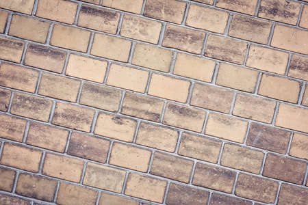 The texture of the brick wall is located at an angleの写真素材