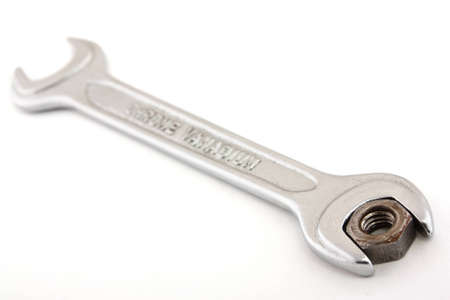 Silver wrench on a white background. Written on a key alloy of which it is made - Chrome-Vanadium.の写真素材