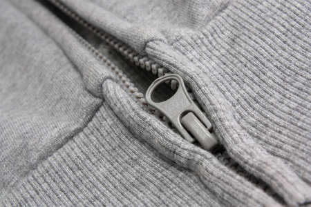 Locking zipper on the jacket close up. Half unbuttoned.の写真素材