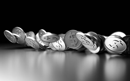 Silver coins fall and spin on a gray mirror surface.の写真素材