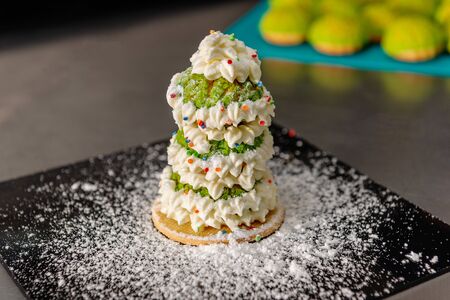 Confectioner makes a cake in the form of figures of Christmas heroes. Handworkの写真素材