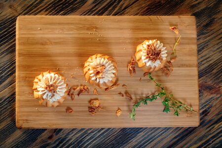 Profiteroles with vegetable filling, tomatoes and herbs on a wooden backgroundの写真素材