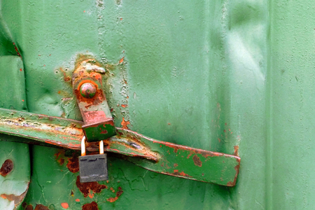 rusty green metal texture of cargo container with padlockの写真素材