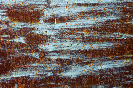 rusty metal texture with peeling blue paintの写真素材