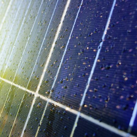 Texture of dark blue solar panel with water dropsの写真素材
