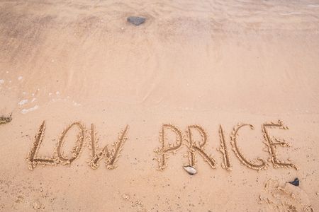 Inscriptions on the sand: low priceの写真素材