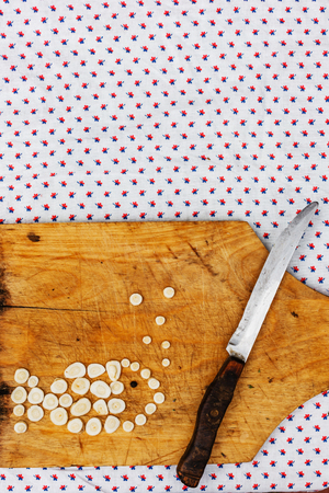 Old kitchen board with fish from celery rootの写真素材